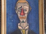 a painting of a clown with a red nose on the wall