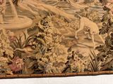 a picture of a tapestry hanging on a wall