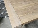a wooden table that has a roll of tape on top of it