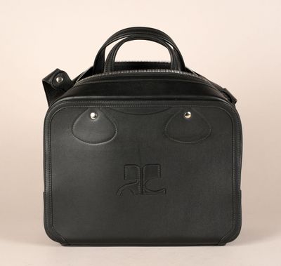 a black leather bag with a monogram logo on the front