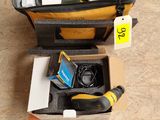 a suitcase with tools in it sitting on the floor
