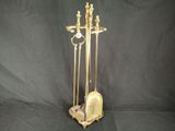 a gold statue of a man and a woman on a stand