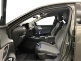 the interior of a car with the door open and the driver ' s seat up