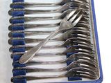 silverware in a blue case with blue handles and a fork