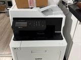 a printer that is sitting on top of a stack of boxes