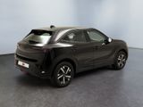 the rear view of a black car parked in a room