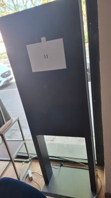 a mirror on the floor in the corner of a room
