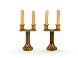 pair of antique brass candlesticks on a white background