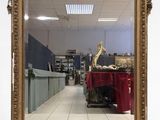 a large mirror that is sitting on the floor