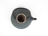 a tea pot that is sitting on a table