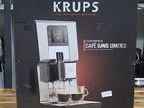 packaging of a coffee machine sitting on top of a wooden table