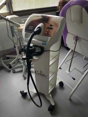 a hair dryer sitting on a cart in a room