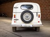 a small white car parked in a garage