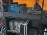 many different tools on the shelves in the room