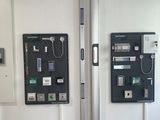 two telephones that are on the wall in the room