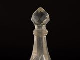 a close up of a glass chess piece on a black background