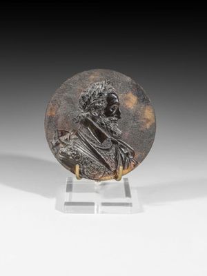 a bronze plaque of a man holding a dog on a stand