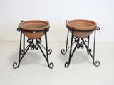 pair of large terracotta planters with wrought iron stands