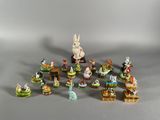 a lot of figurines that are sitting on a table