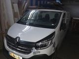the white van is parked in the garage of the building