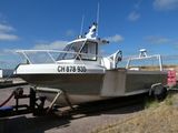a boat that is sitting on the side of the road