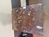 a marble slab on a shelf in the corner of a room