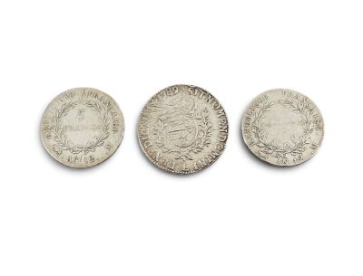 three silver coins, one of which is a sovereign and the other of which is a sovereign