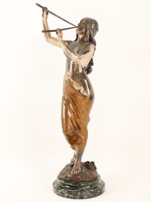 an image of a statue of a woman holding a sword