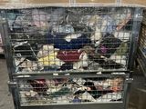 a metal cart with many items in it in a warehouse