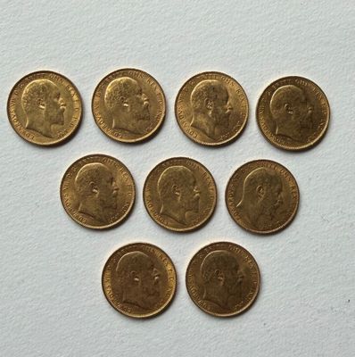 six different british coins are arranged in a circle on a white surface