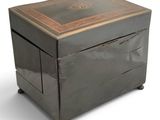 a box that is sitting on wheels on a white surface