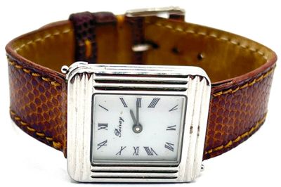 montre-bracelet avec bracelet en cuir marron et chiffres romains