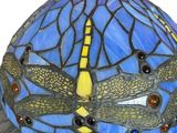 a blue and yellow lamp with dragonflies on it