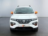 the front view of a white suv parked in a white room