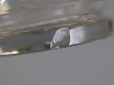 a close up view of a glass object with water in it