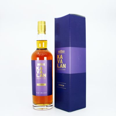 the bottle of kavalan is next to a blue box