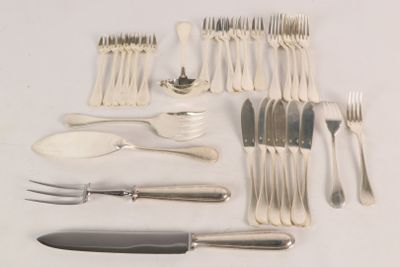 a lot of silverware on the table and silverware on the table