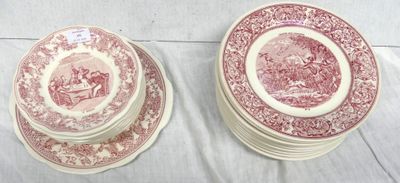 two red and white plates sitting on top of each other on a table