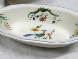 a bowl with a bird design on it on a table