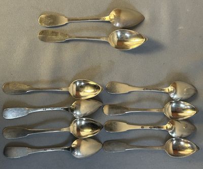 five spoons and two spoons on a table