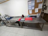 a large stainless steel work table in a commercial kitchen