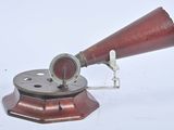 an old fashioned telescope on a stand on a white surface