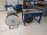 a machine that is sitting on the floor next to a table