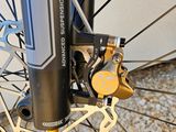 a close up of a bike ' s front brake and disc