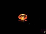 a close up of a glass ball on a black surface