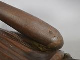 a close up of a baseball glove and a bat