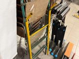 a stack of chairs and a ladder in a room