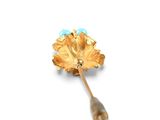 an image of a gold and turquoise flower broochle