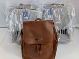 brown leather backpack with zippers and clear plastic bags on a white surface