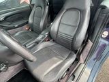 the interior of a car with two seats and a steering wheel